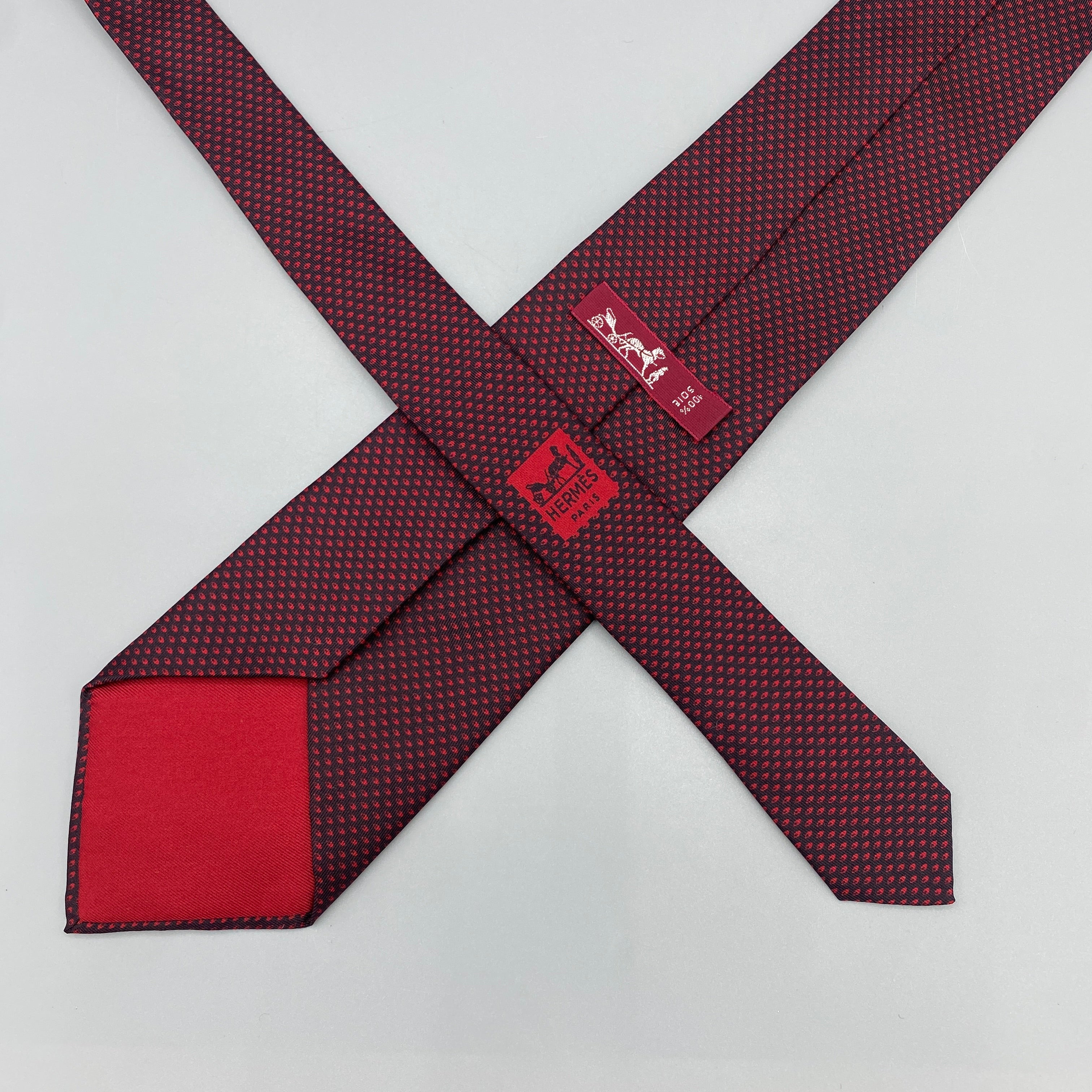 Cravate noir Hermès à pois rouges