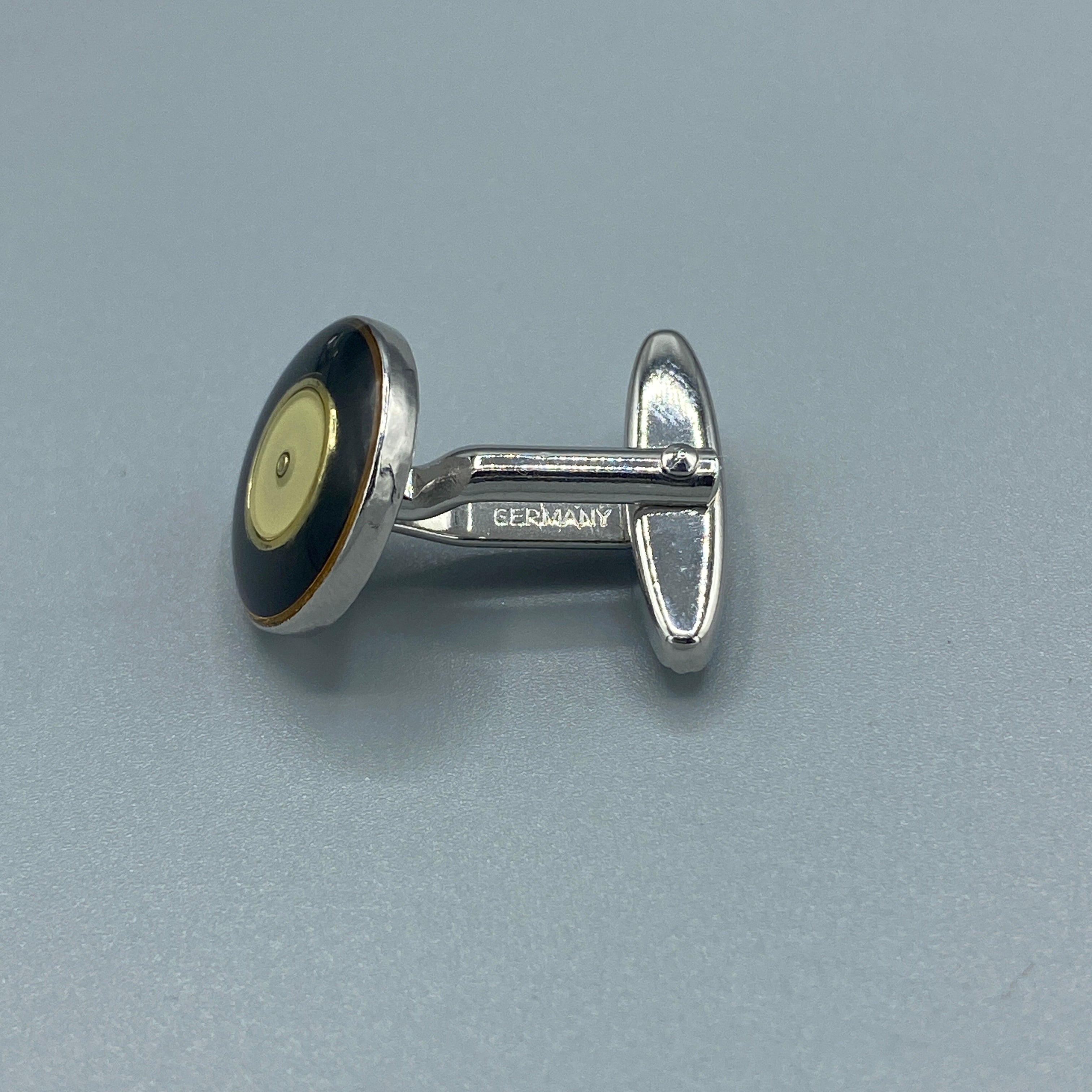 Boutons de manchette argentés ronds noirs et or