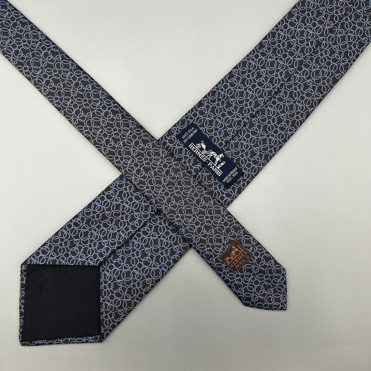 Cravate Hermès marron avec bulles bleues - Le Beau Gustave