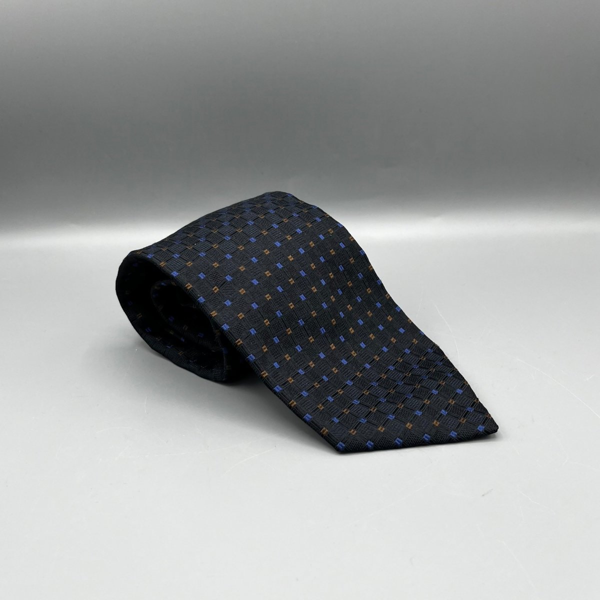Cravate Namani noire à motifs bleus et bruns - Le Beau Gustave
