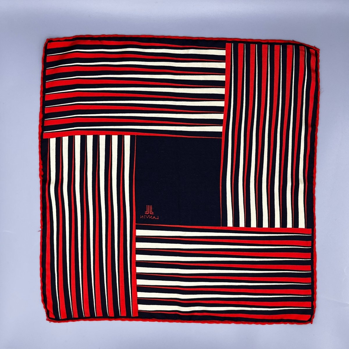 Pochette Lanvin noire à motifs orange et beige - Le Beau Gustave