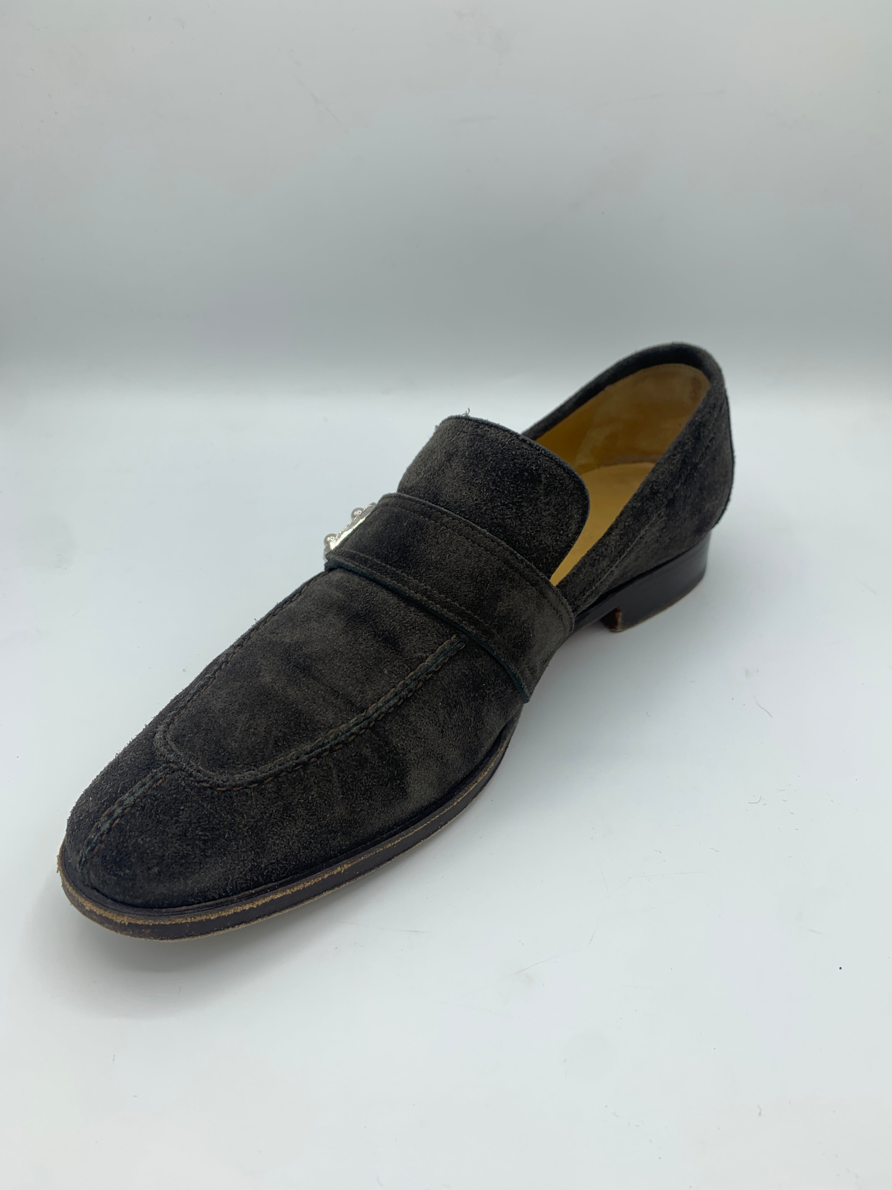 Mocassins Hermès marron glacé à boucles.