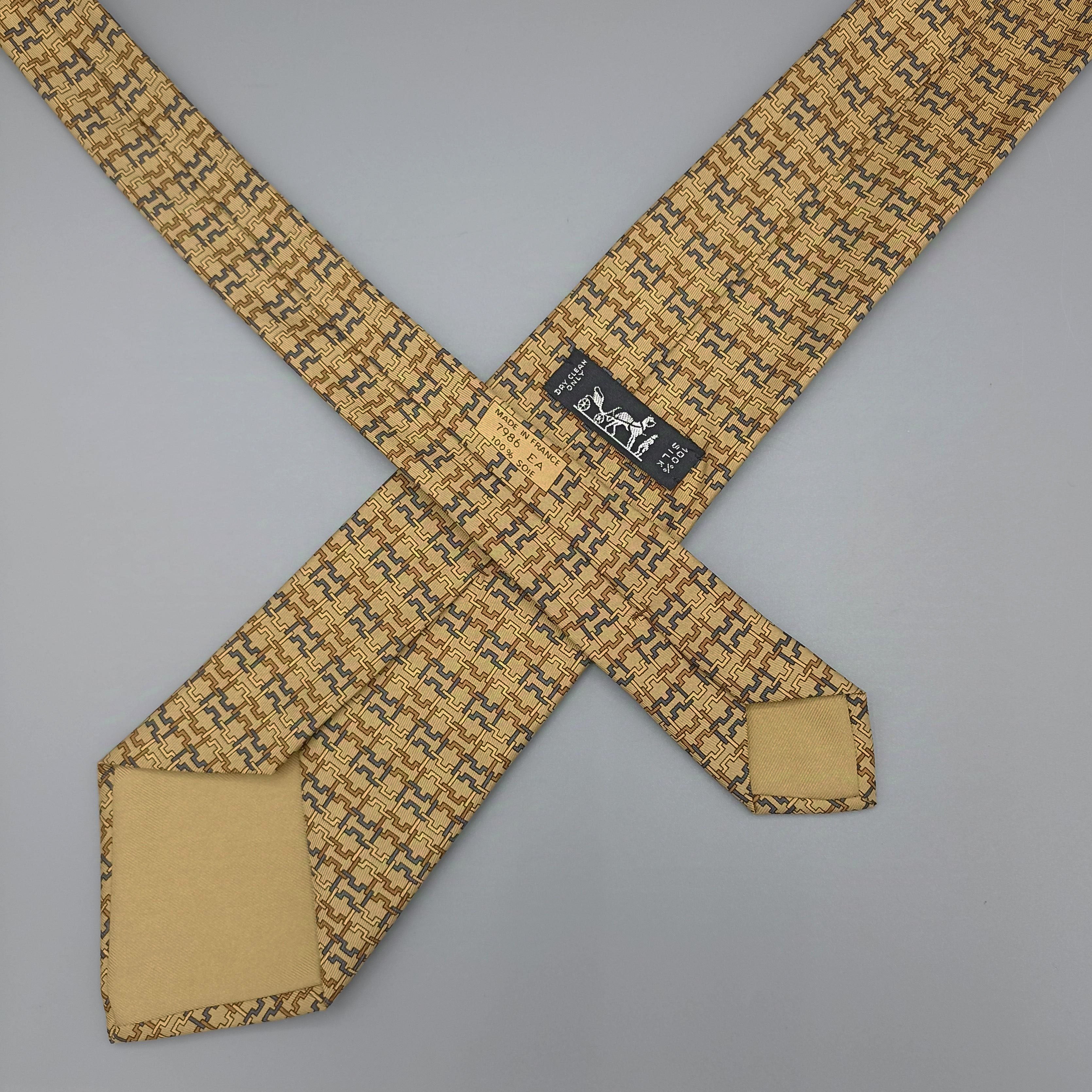 Cravate Hermès jaune à motif H
