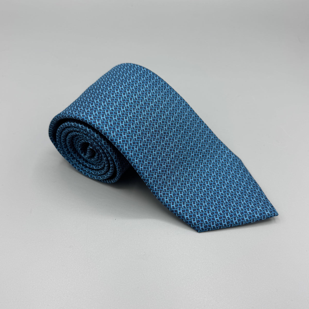 Cravate Hermès bleu turquoise à motif H