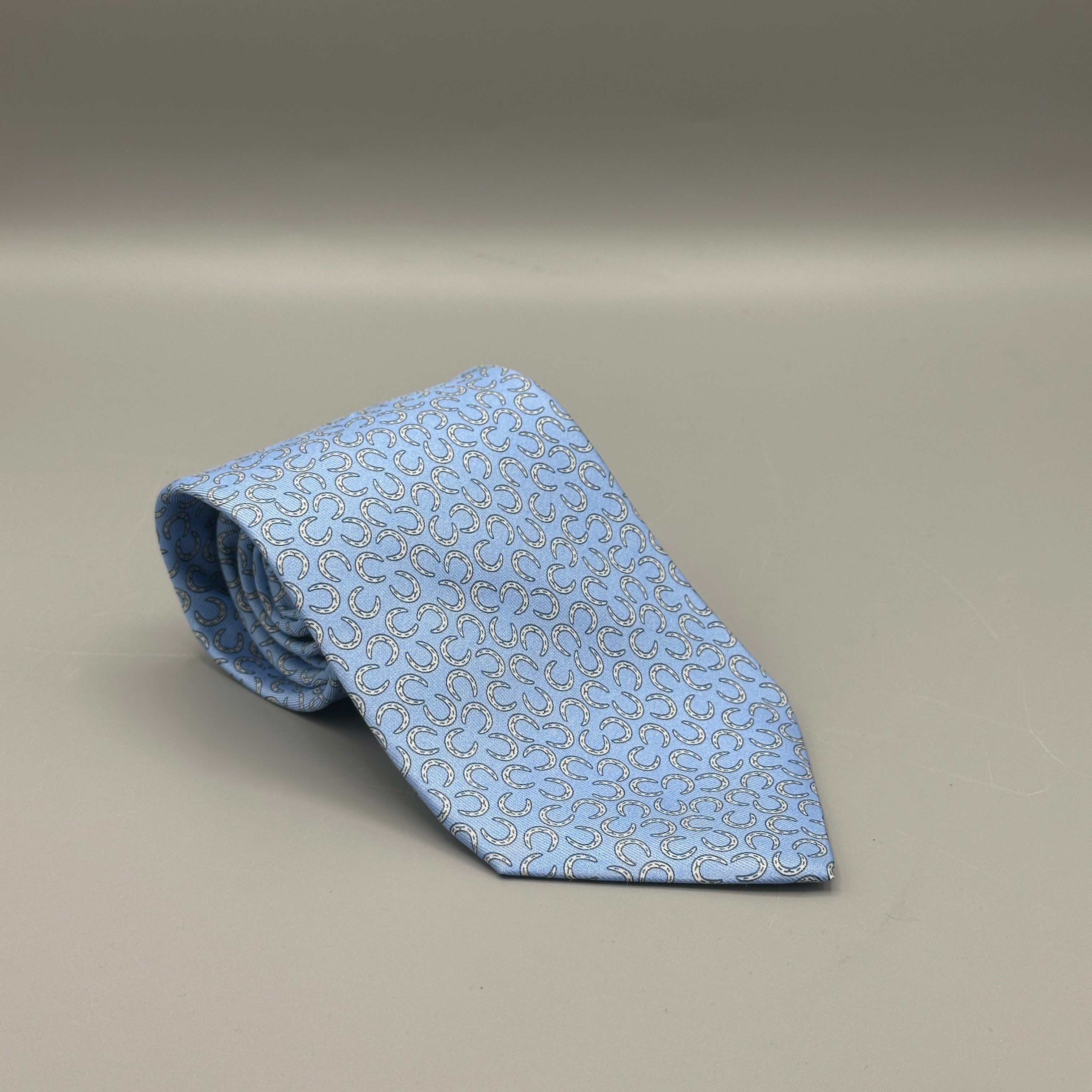 Hermès blue tie with horseshoe pattern