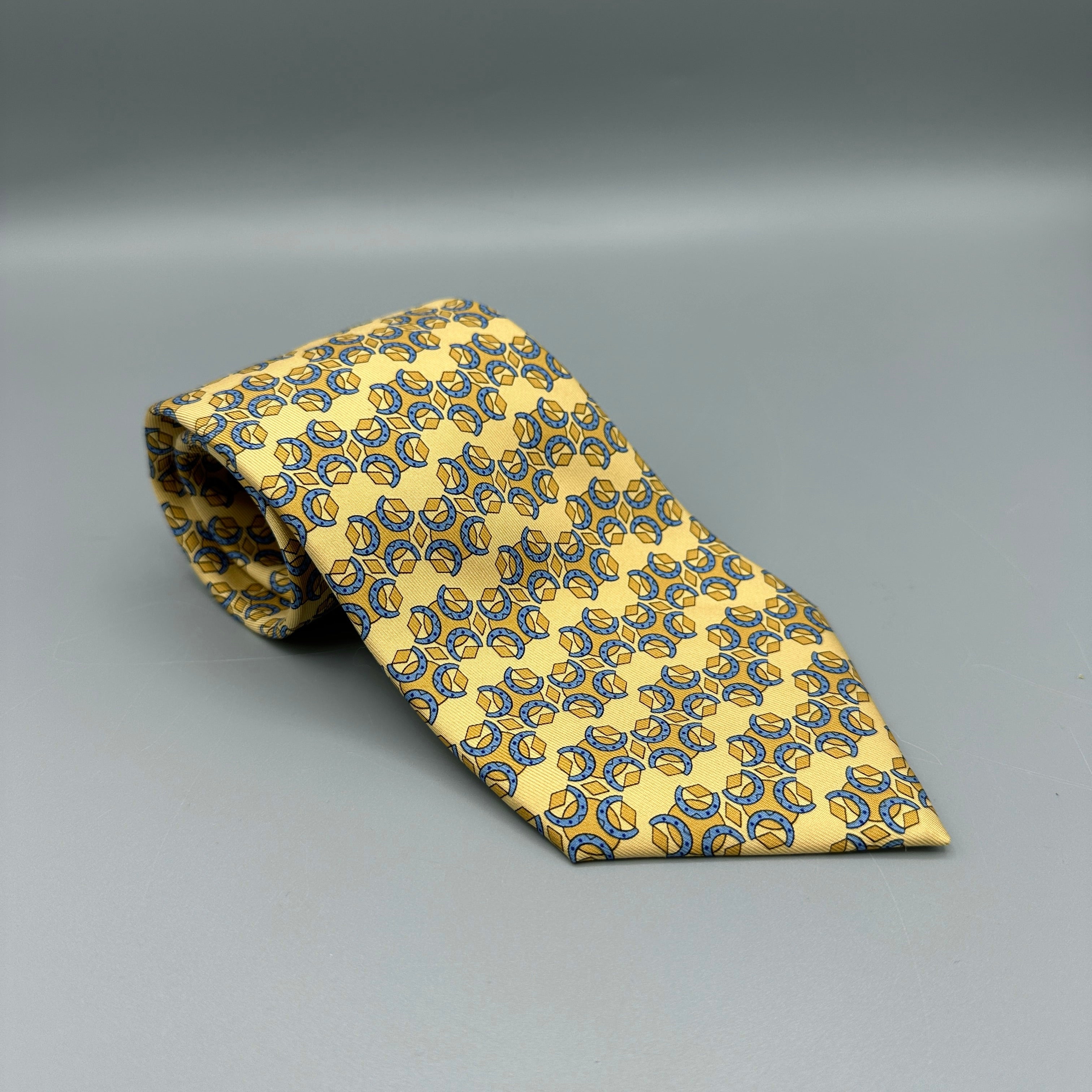Cravate Hermès jaune à motifs géométriques