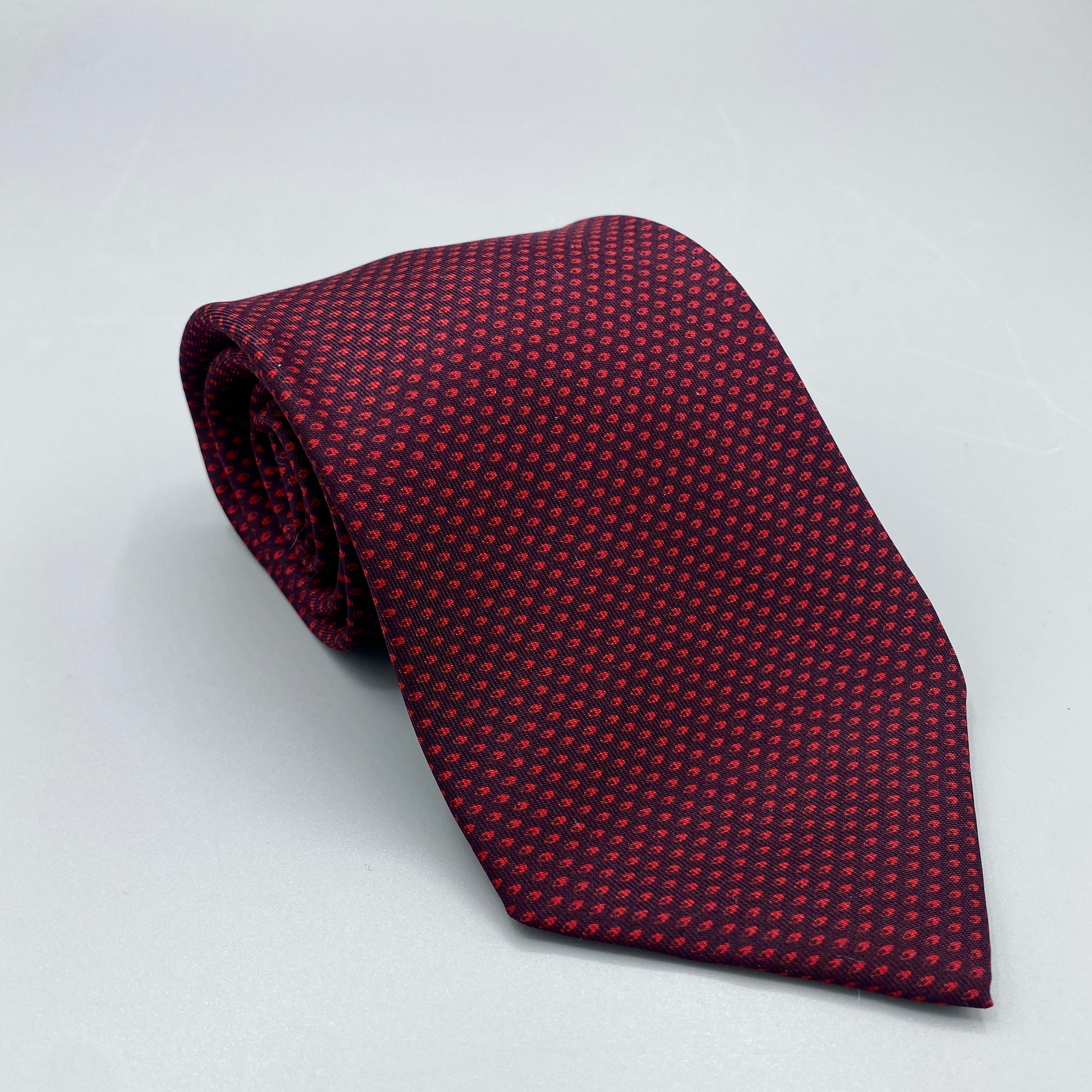 Cravate noir Hermès à pois rouges
