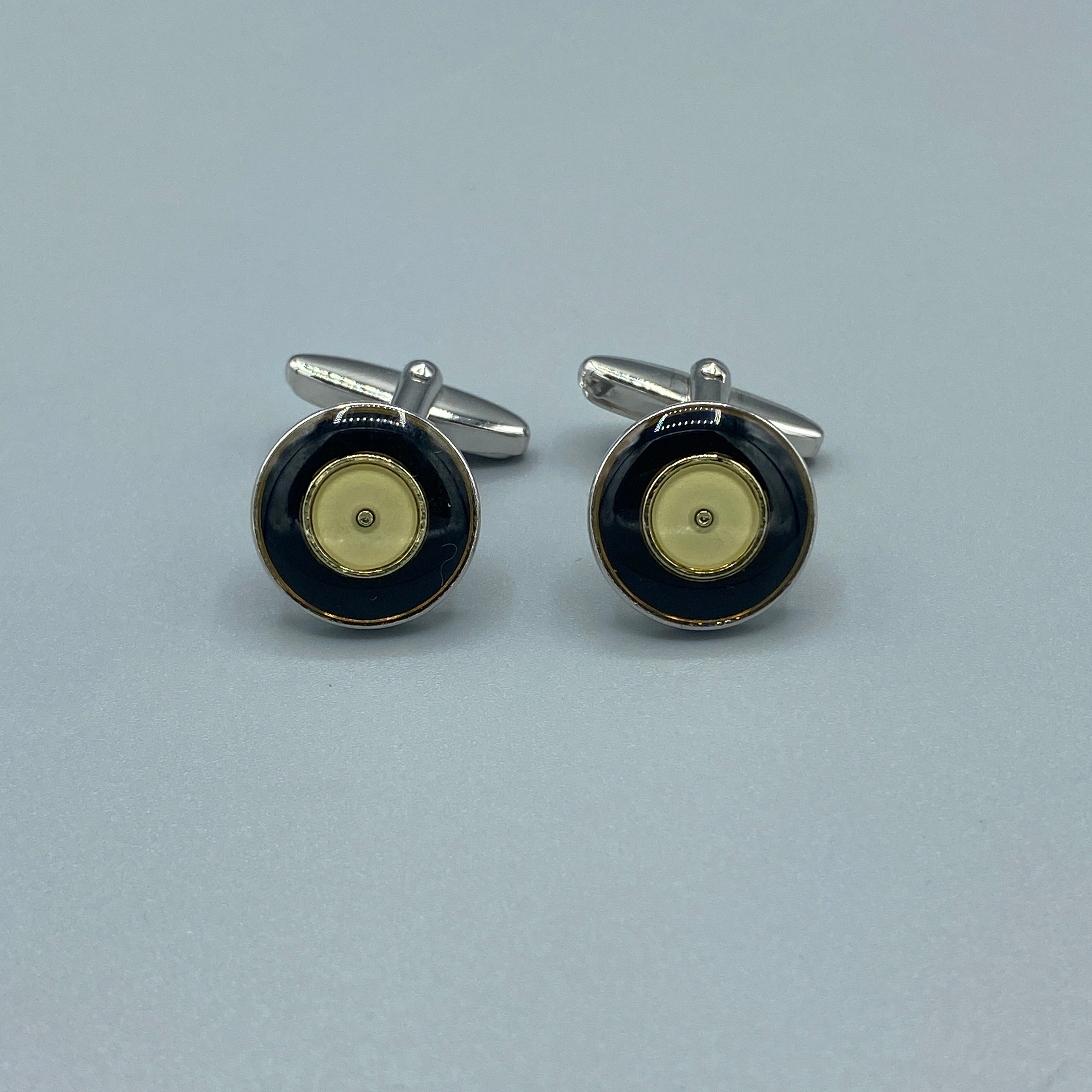 Boutons de manchette argentés ronds noirs et or