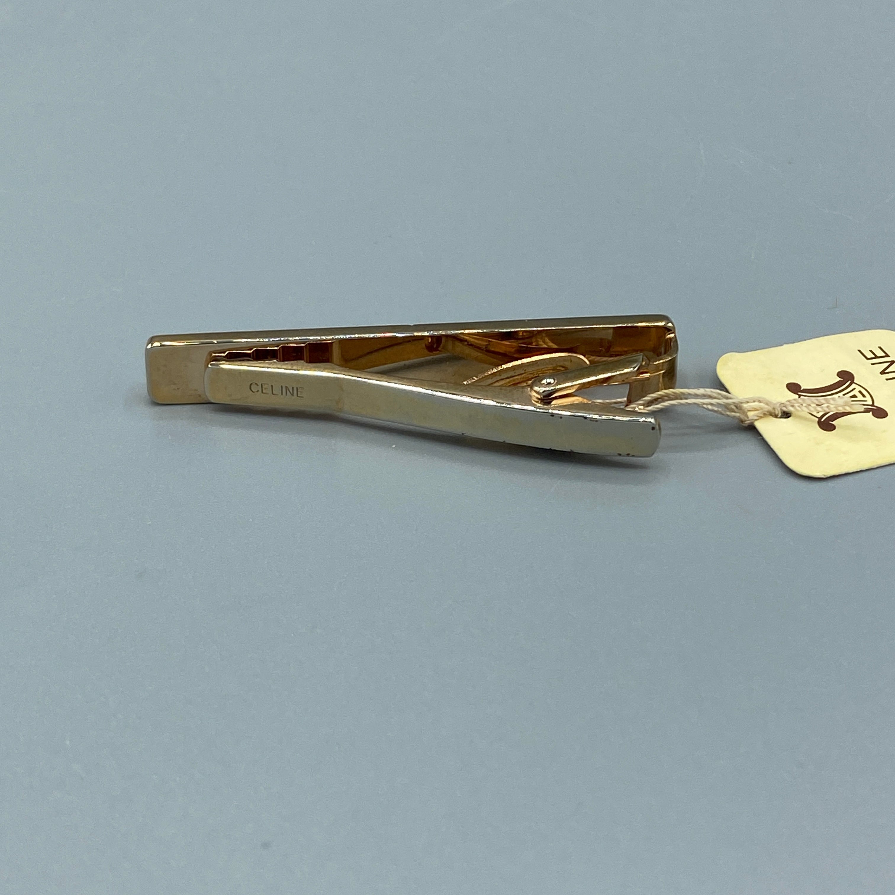 Boutons de manchette et pince à cravate dorés Céline