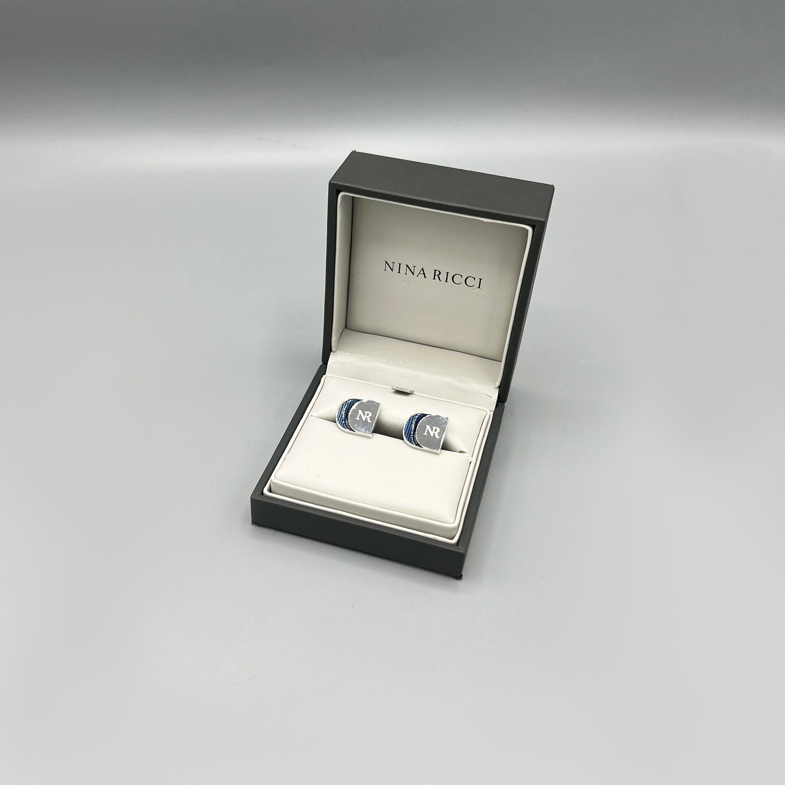 boutons de manchette argentés Nina Ricci