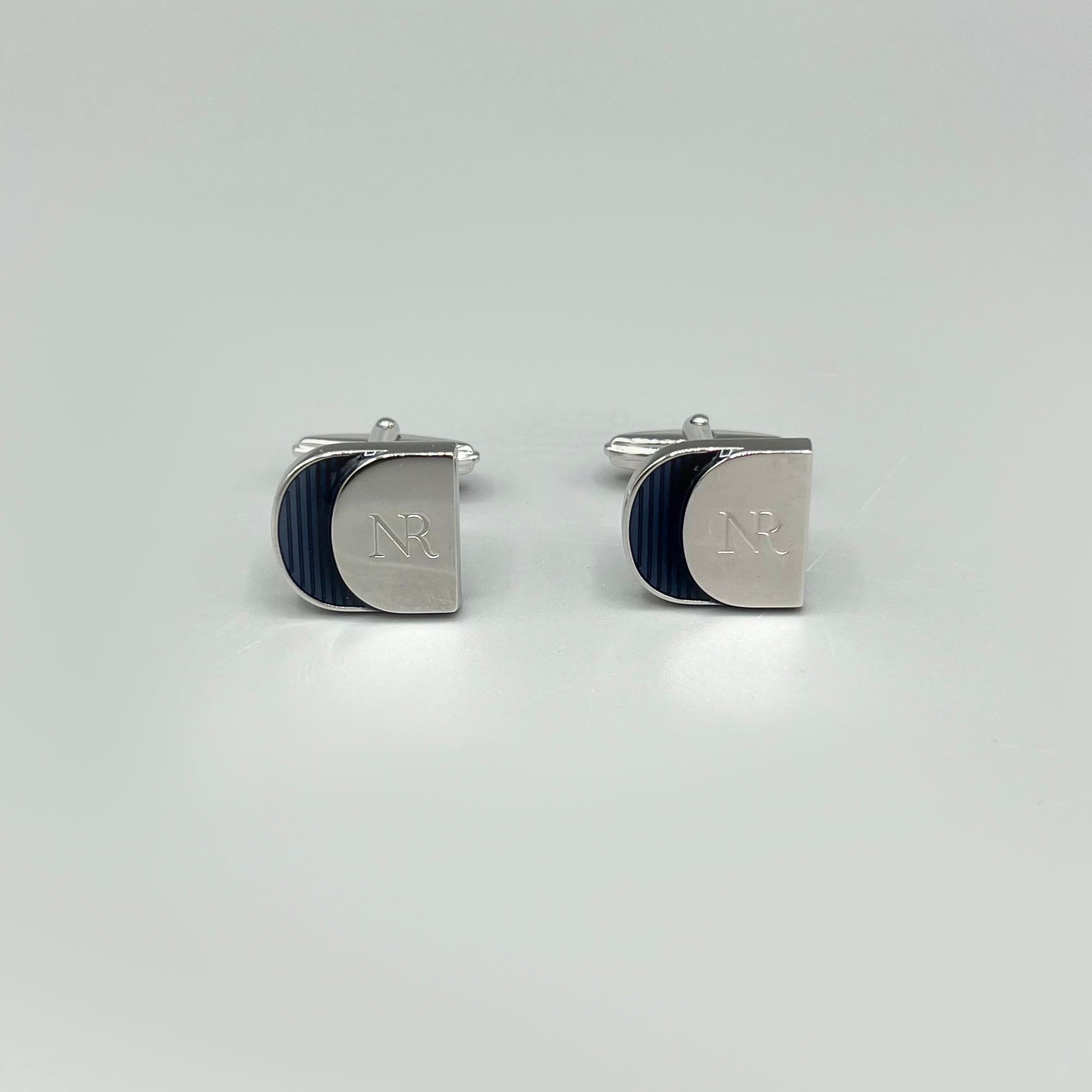 boutons de manchette argentés Nina Ricci