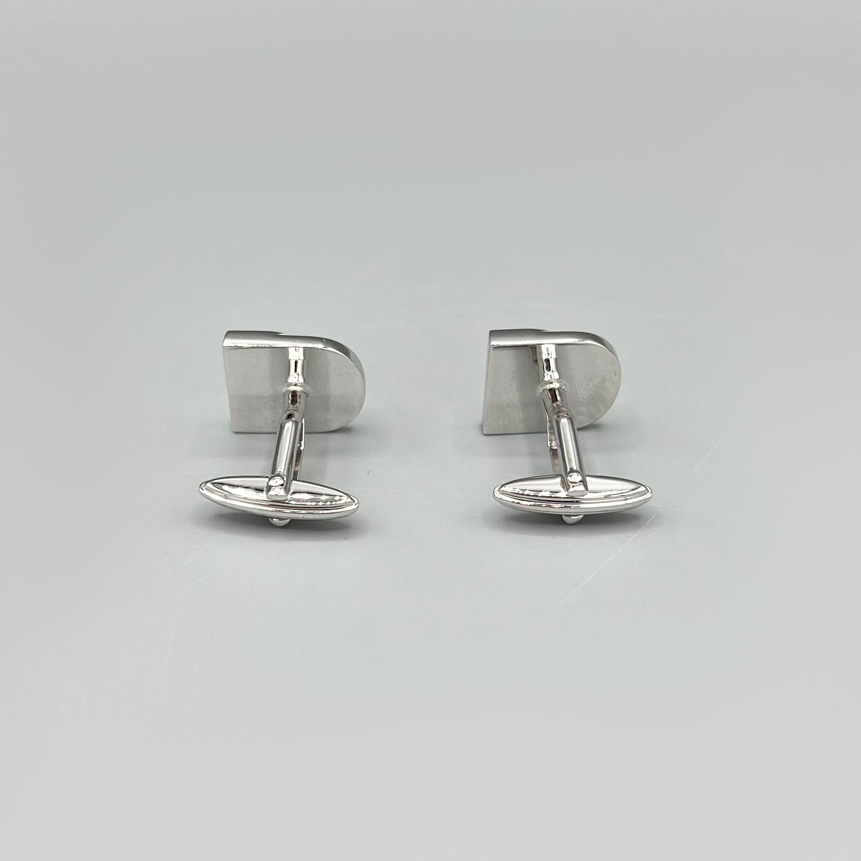boutons de manchette argentés Nina Ricci