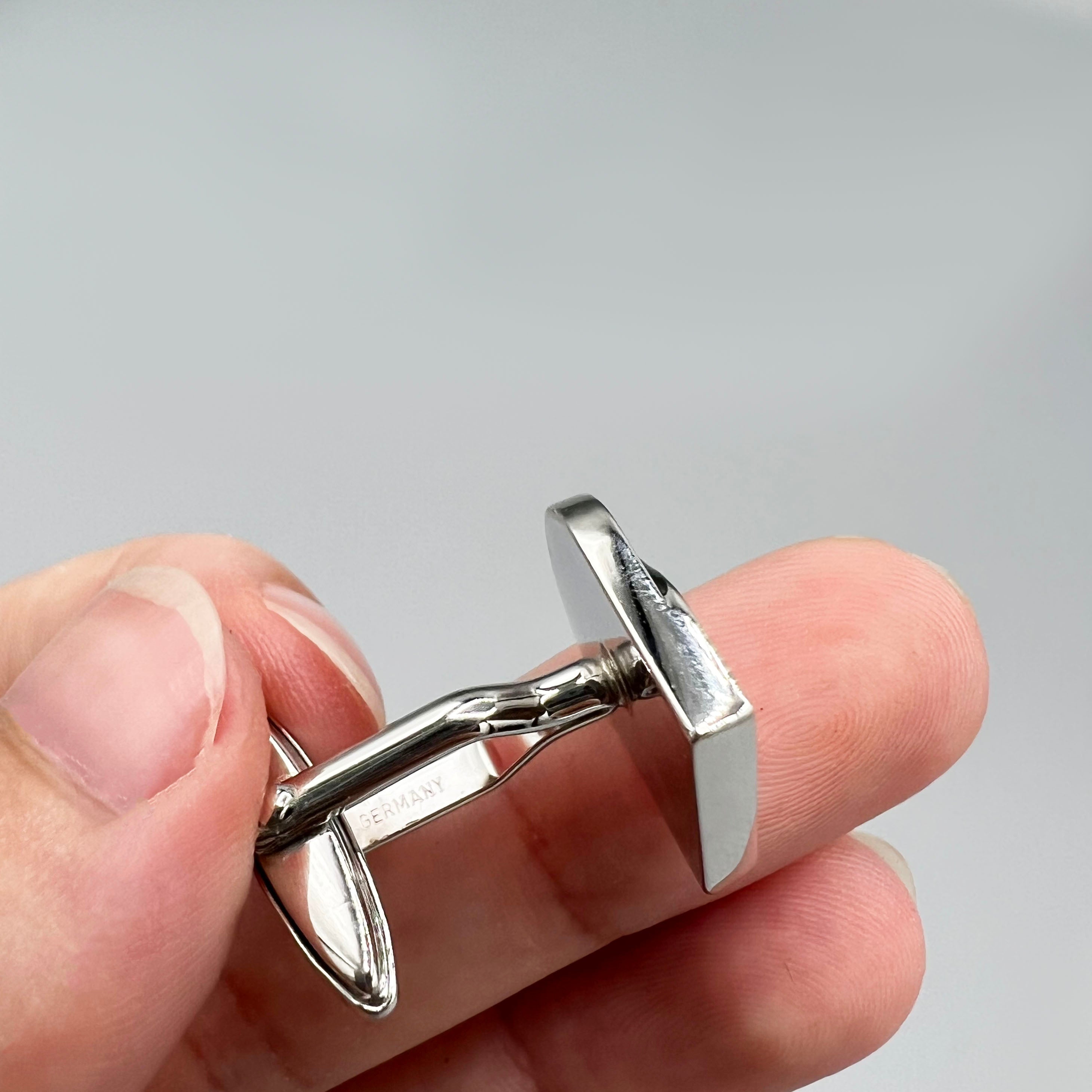boutons de manchette argentés Nina Ricci