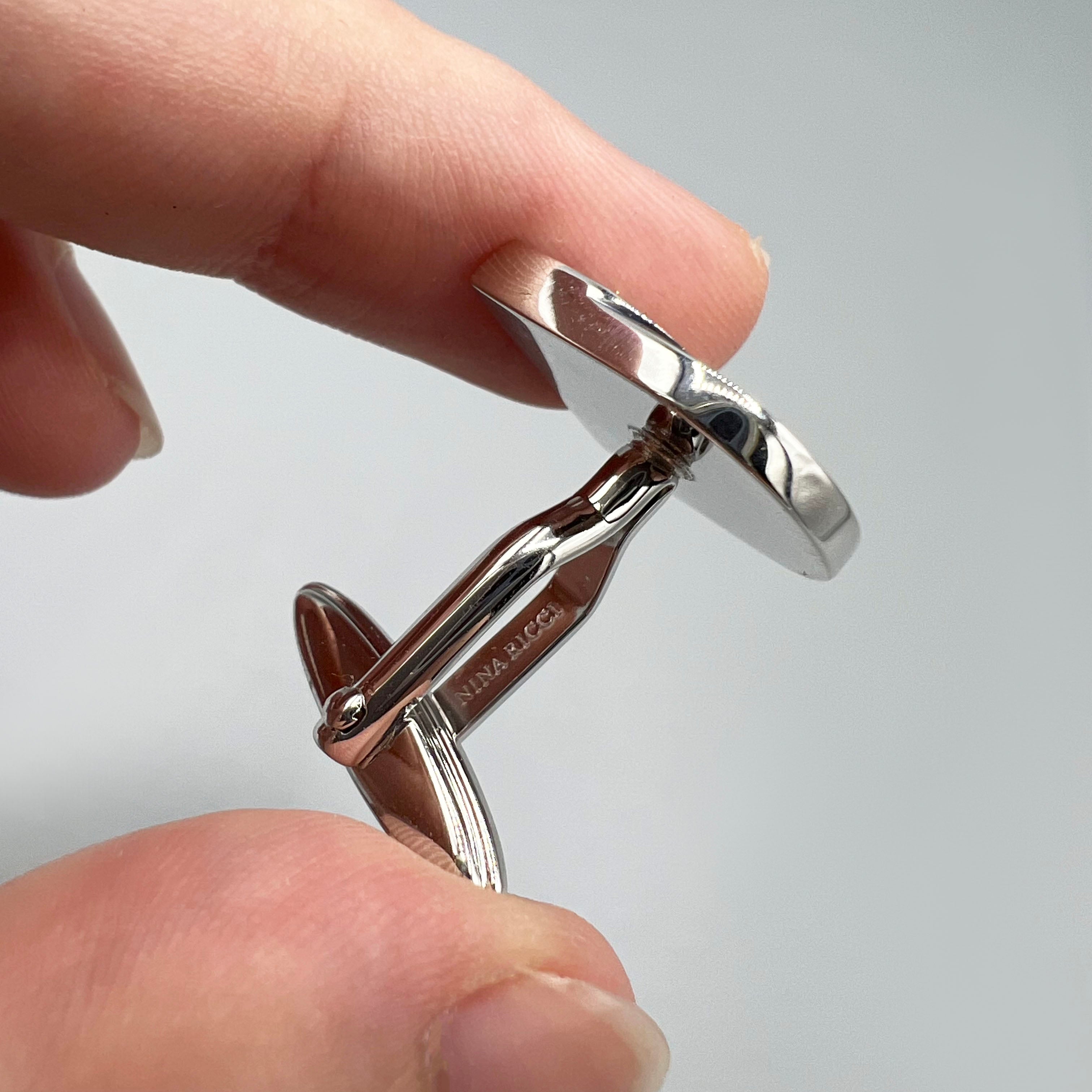 boutons de manchette argentés Nina Ricci