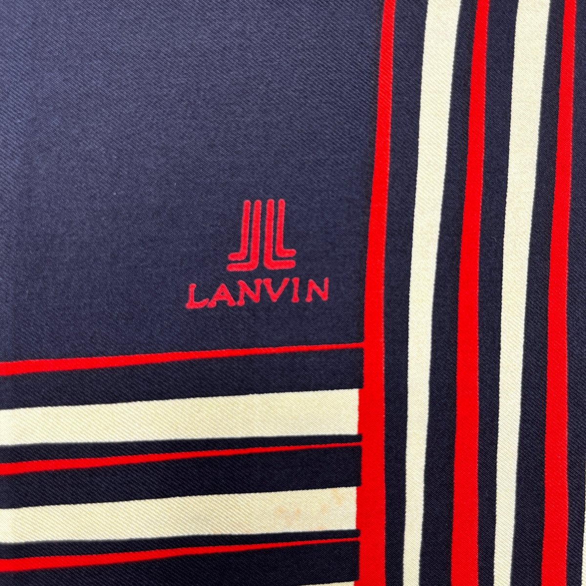 Pochette Lanvin noire à motifs orange et beige - Le Beau Gustave