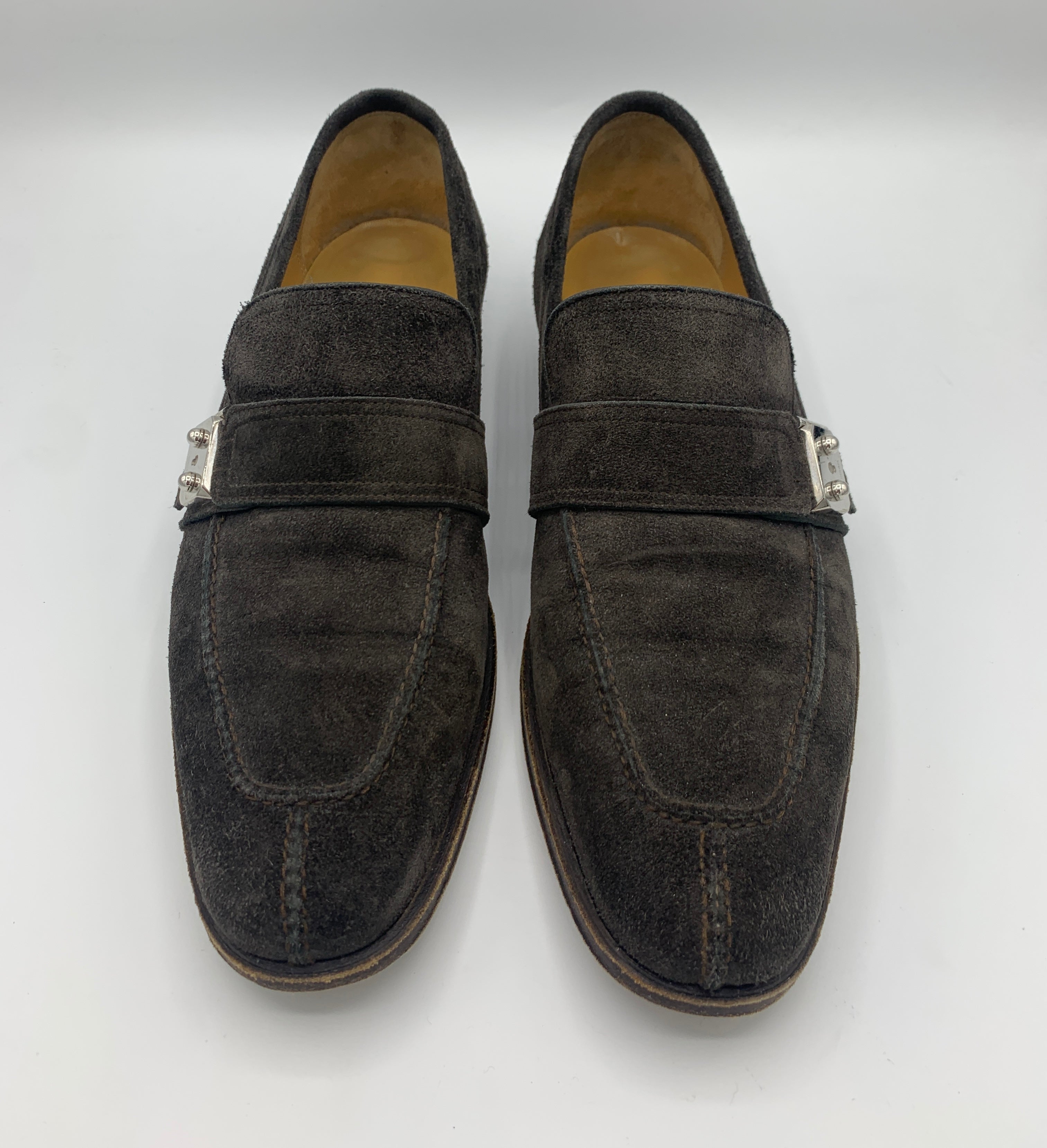 Mocassins Hermès marron glacé à boucles.